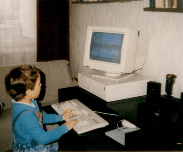 4 years old happy Wojtek is playing *Winter Challenge* on a *386SX IBM PC* (circa 1991-1992)
